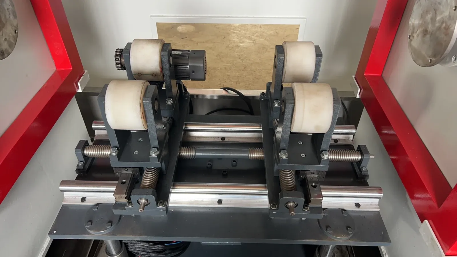 Adjustable support rollers on guide rails between the magnetizing frames