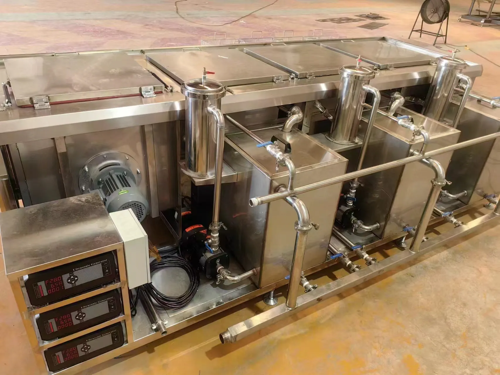 Rear of the STYQ-1000 line: ultrasonic generators, circulation pumps, filters and piping